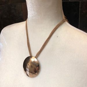 Adjustable , gold disc necklace.
